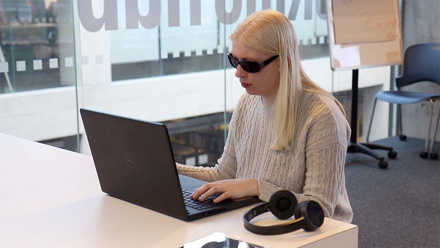 SuperNova User, Charlotte using her laptop